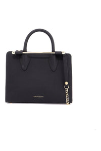 Strathberry mini tote structured in black leather with gold details