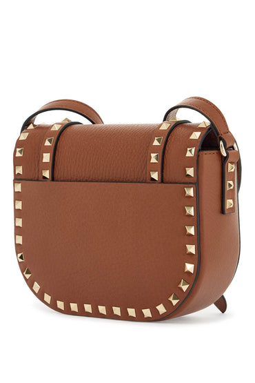 Valentino Garavani small messenger crossbody bag in brown hammered leather with studs