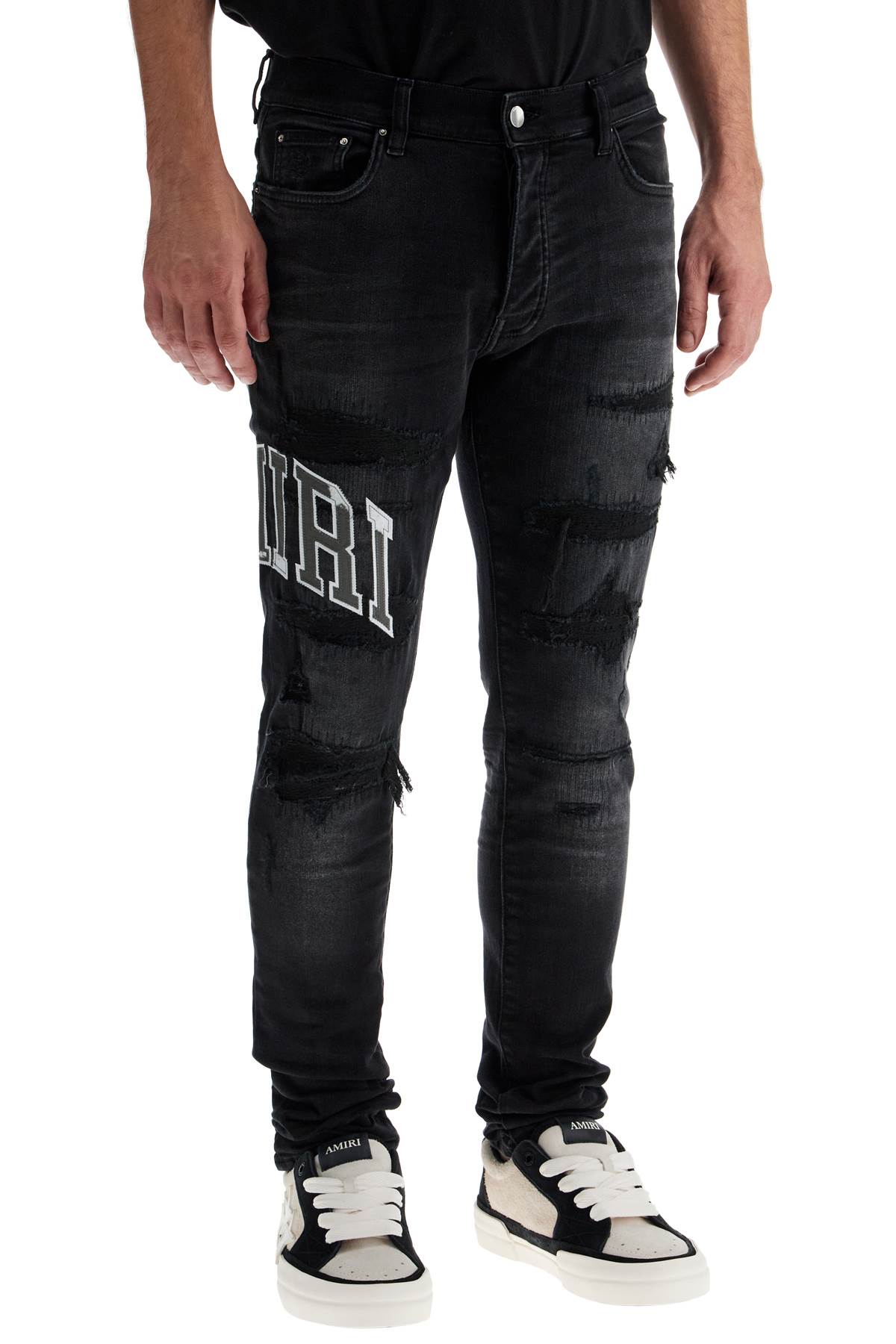 Amiri skinny jeans with varsity logo