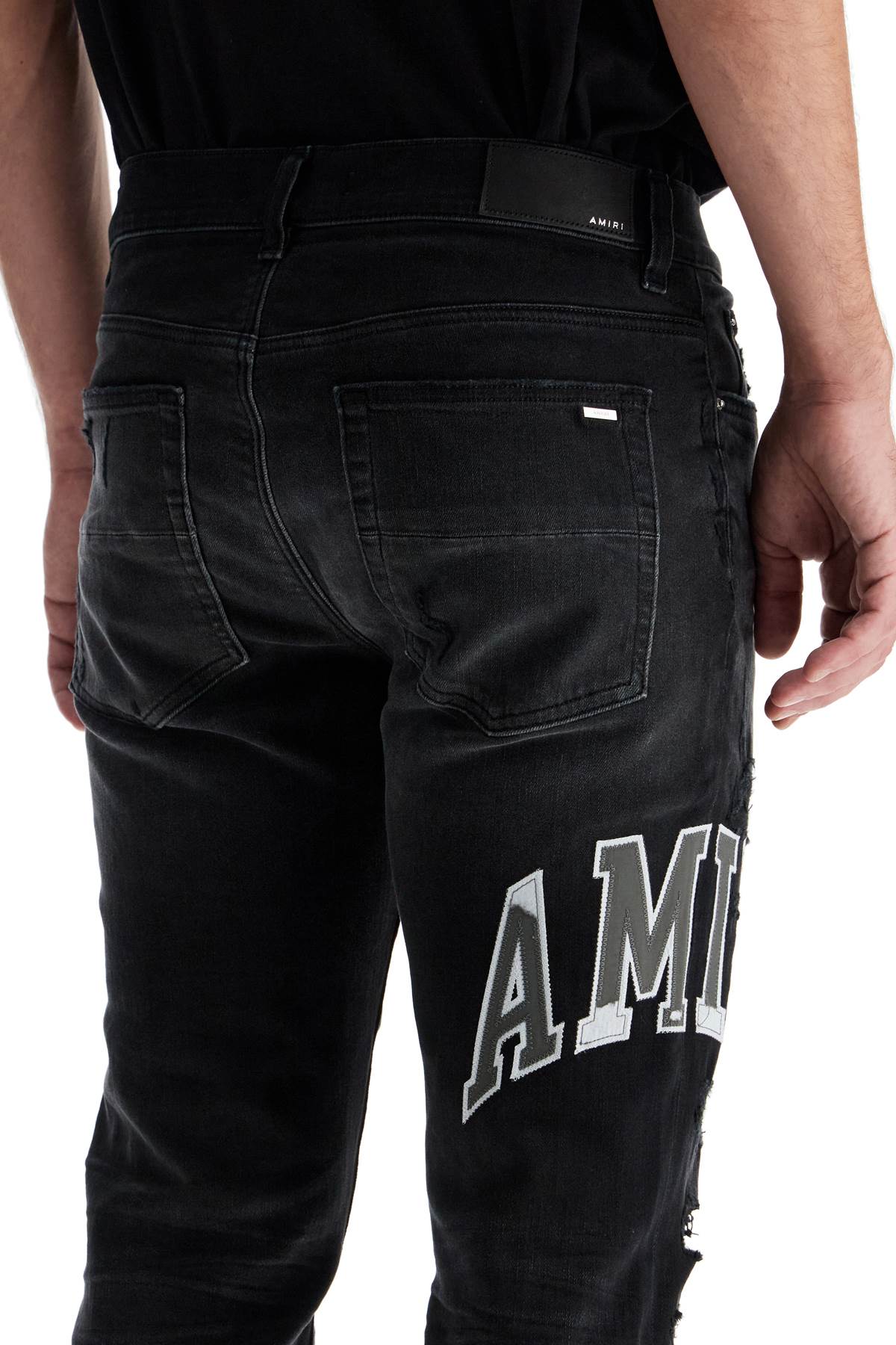 Amiri skinny jeans with varsity logo